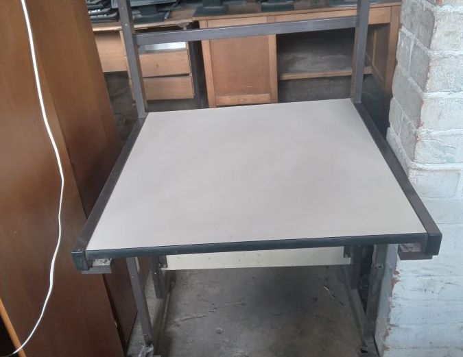 Wheeled white-top desk