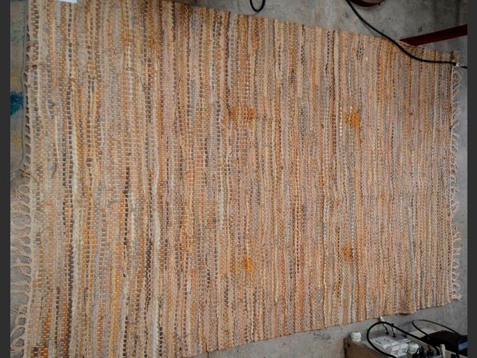 TONES OF BROWN WOVEN LEATHER CARPET, 177 x 118cm