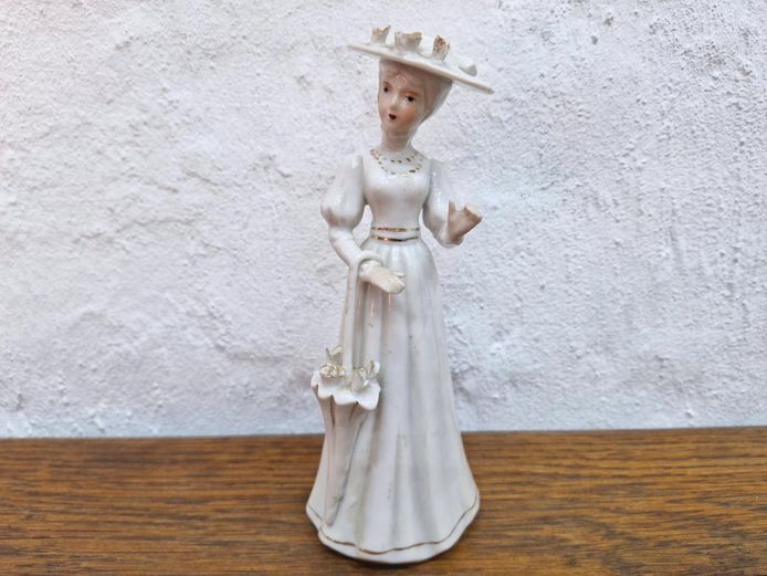 Porcelain Figurine of an Elegant Lady with Umbrella and Gold Accents