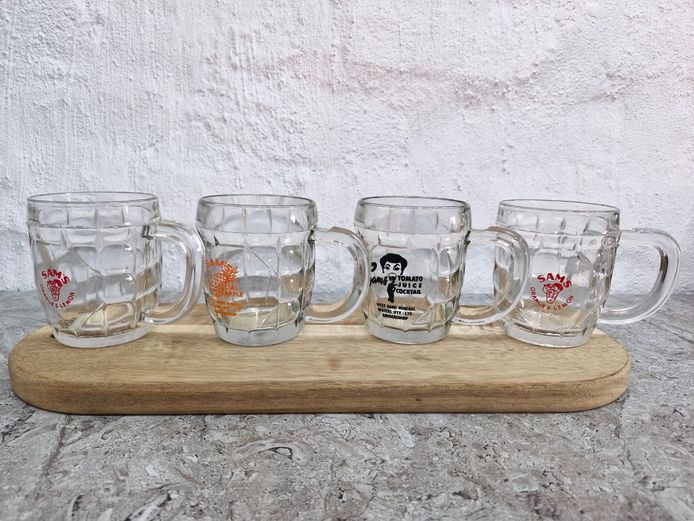 Collection of Branded Glass Mugs – Featuring Sam’s Tomato Juice Cocktail and Fruit Flavors