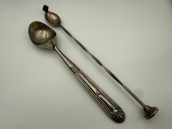 2 silver spoons - 1 ice cream scoop and 1 cocktail stirrer