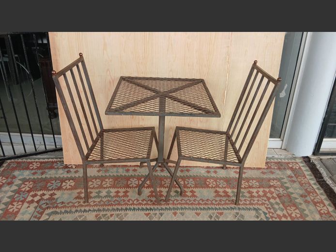 Wrought iron table with 2 chairs