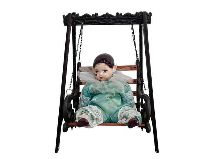 Vintage Porcelain Clown Doll on Decorative Cast Iron and Wood Swing Bench