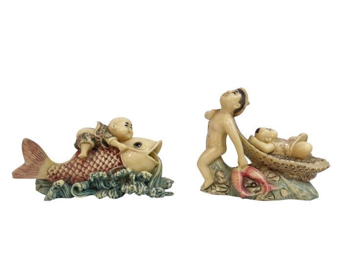 Pair of Vintage Chinese Resin "Boy and Fish" Figurines