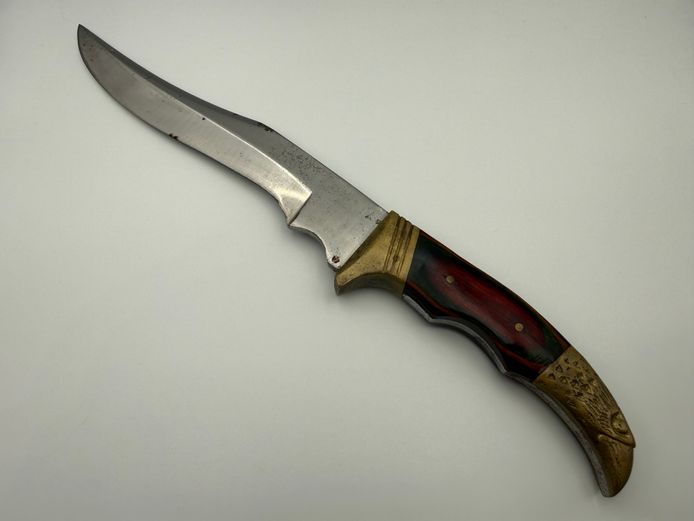 Exquisite collectors hunting knife with wooden handle and brass eagle design