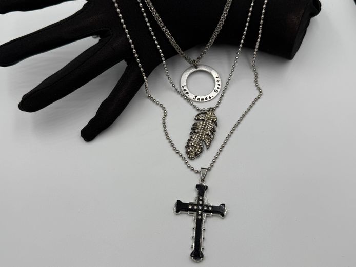 Lot of 3 necklaces - One with cross pendant, one with feather and one with circle pendant