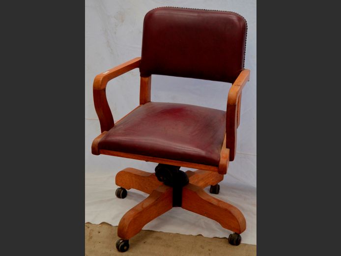 OAK SWIVEL ARMCHAIR WITH BURGUNDY VINYL UPHOLSTERY