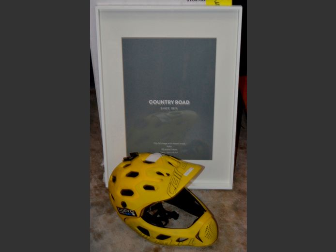 BIKE HELMET & AN A2 POSTER FRAME, 60.5 x 43cm