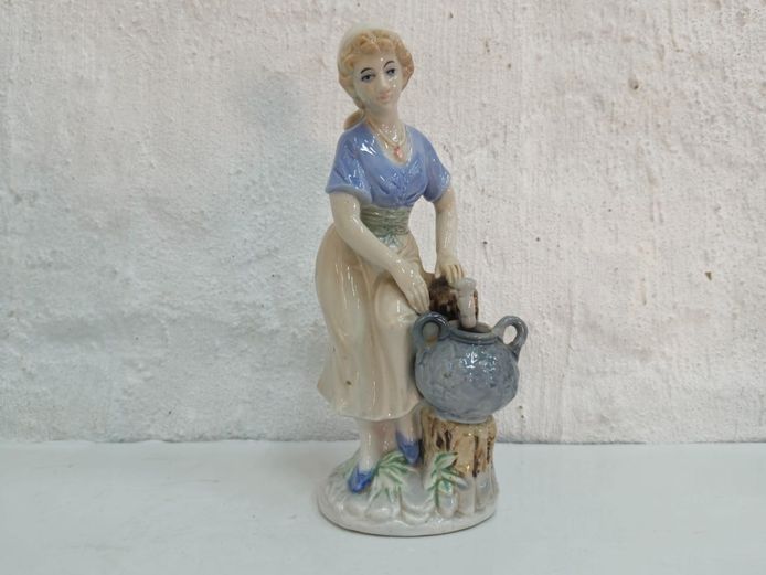 Porcelain Woman Figurine with Water Jug on Stump