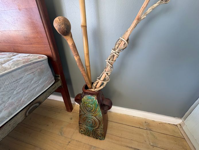 Decorative ceramic Mexican style vase with sticks