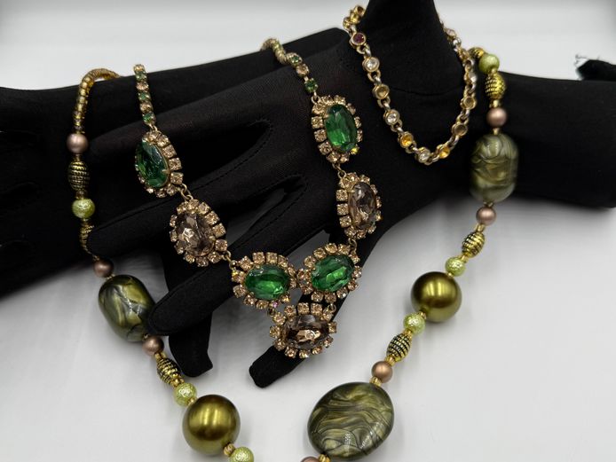 Costume jewellery - two greenish necklaces and bracelet