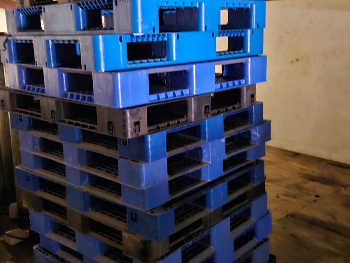 BLUE AND BLACK PLASTIC PALLETS