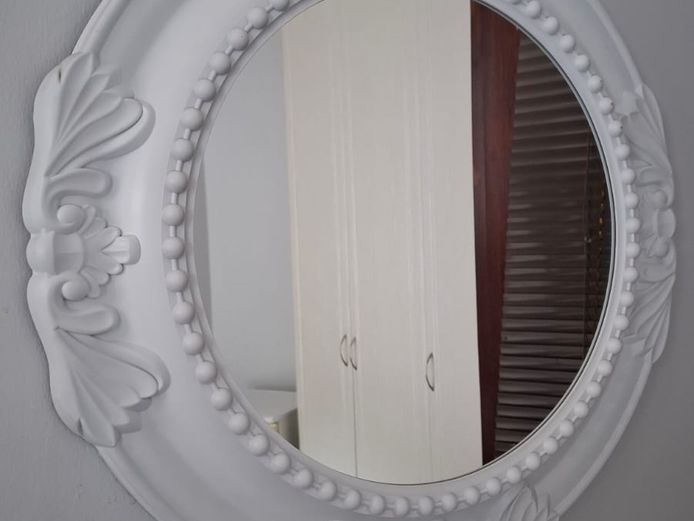 Round framed mirror