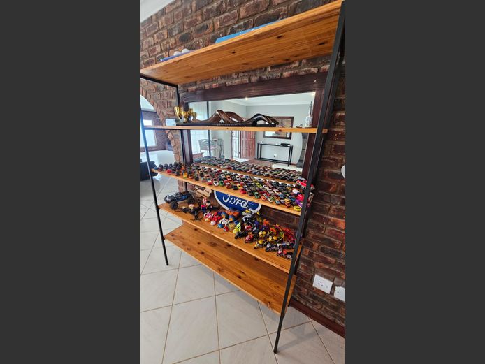 Wooden display shelf with toy cars