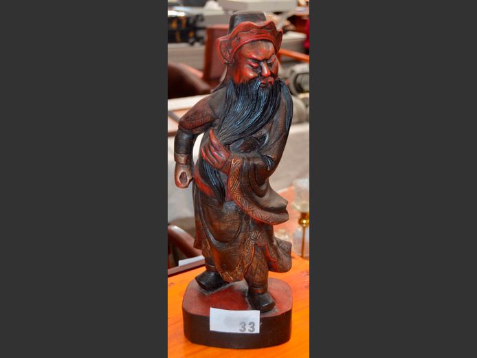 EASTERN CARVED ROSEWOOD FIGURINE OF A MAN, 46cm High