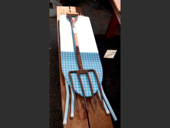 LOT: IRONING BOARD & A GARDEN FORK