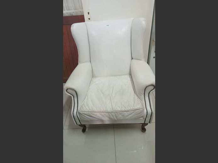 White leather wing back chair