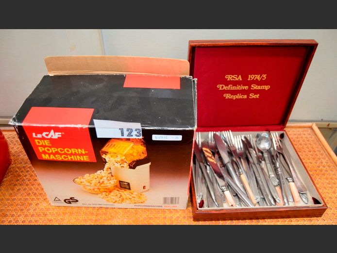 ASSORTED CUTLERY IN CASE & A POPCORN MACHINE [Switches on, untested further]