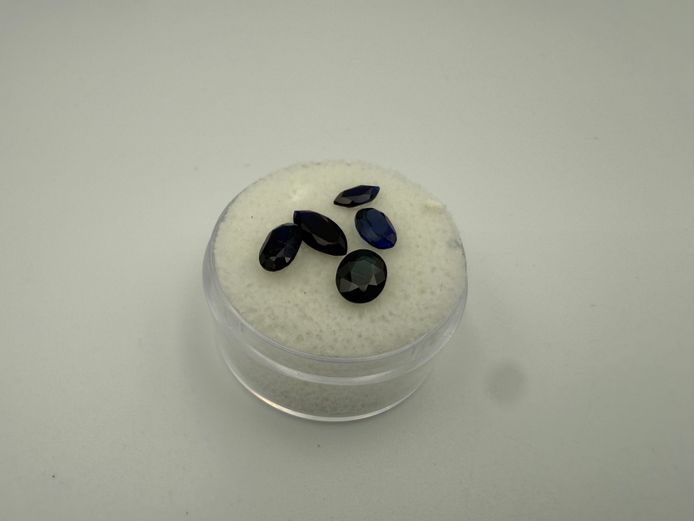 4 Tanzanites and one greener stone