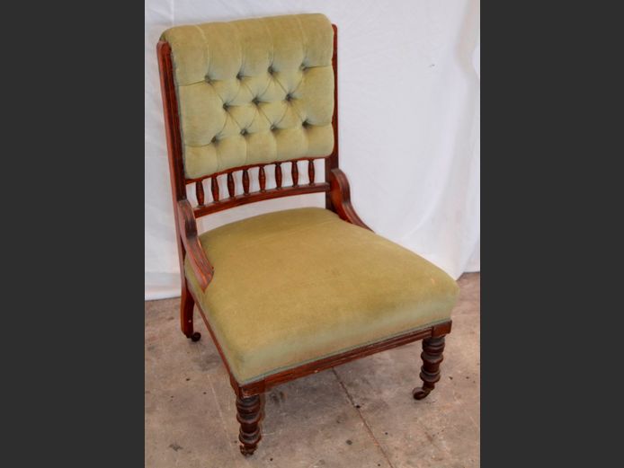 ANTIQUE IMBUIA & UPHOLSTERED BUTTON BACK LOW CHAIR ON CASTORS
