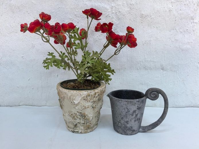 Potted Artificial Red Flowers & Rustic Metal-Style Pitcher Planter