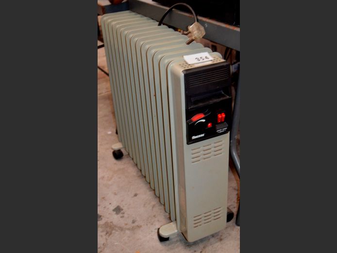 13-FIN OIL HEATER [Switches on]
