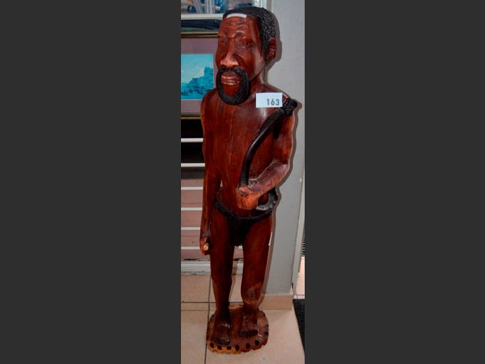 CARVED FIGURE OF AN AFRICAN MAN, 130cm High
