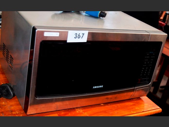 SAMSUNG STAINLESS STEEL FINISH ELECTRONIC MICROWAVE [Switches on, no plate]