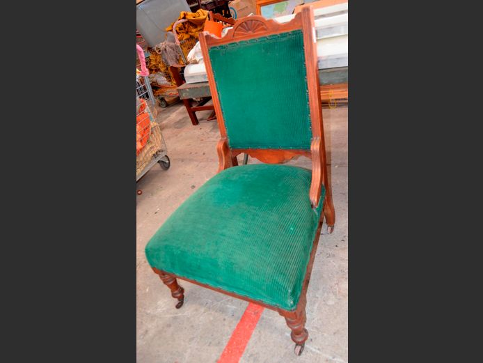 CARVED TEAK & EMERALD UPHOLSTERED LIBRARY CHAIR ON CASTORS