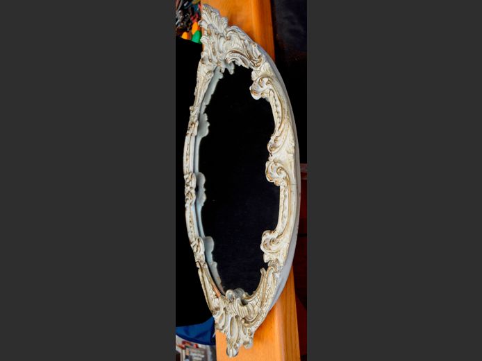 FRENCH STYLE WHITE ORNATELY FRAMED OVAL MIRROR, 84 x 49cm