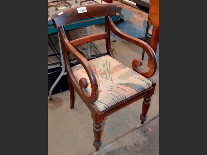 CARVED MAHOGANY SCROLLED ARMCHAIR WITH UPHOLSTERED SEAT [1 corner chipped on back rest]