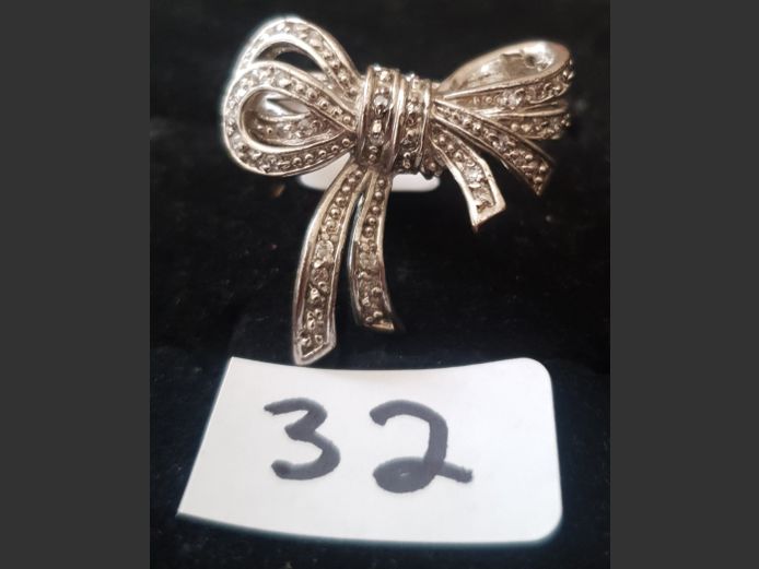 SILVER BOW DRESS RING WITH CLEAR STONES