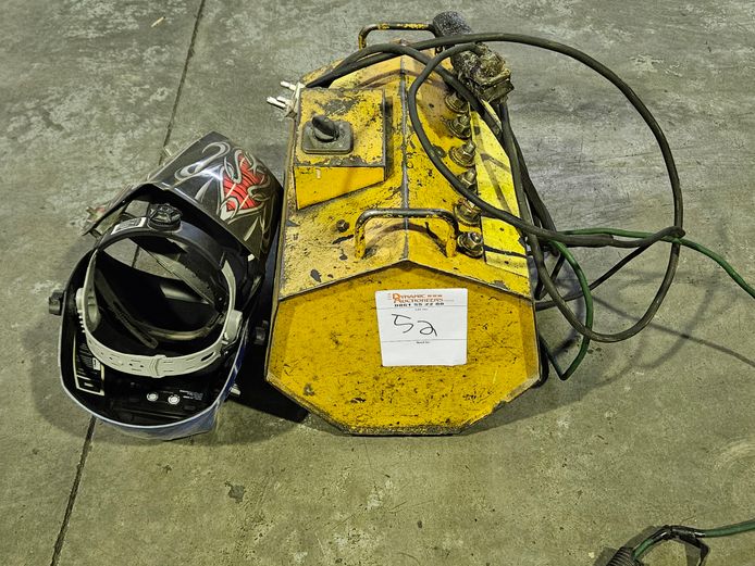 YELLOW WELDER WITH WELDING HELMET