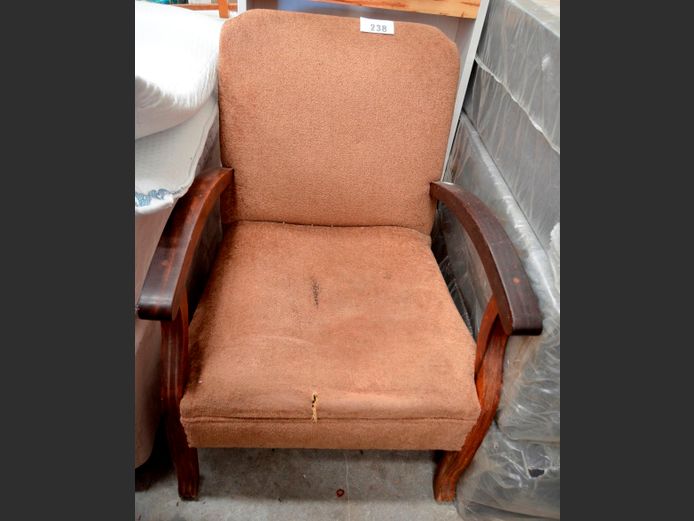 BROWN UPHOLSTERED ARMCHAIR [Seat torn & sunken]