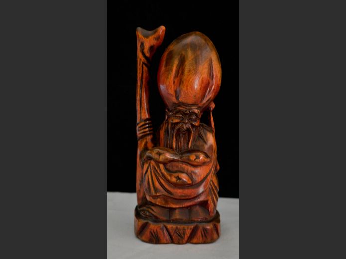 CARVED FIGURINE OF A CHINESE MAN, 19cm High