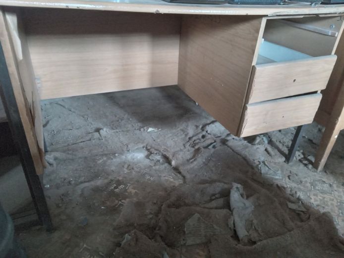 Wooden office desk with one broken drawer