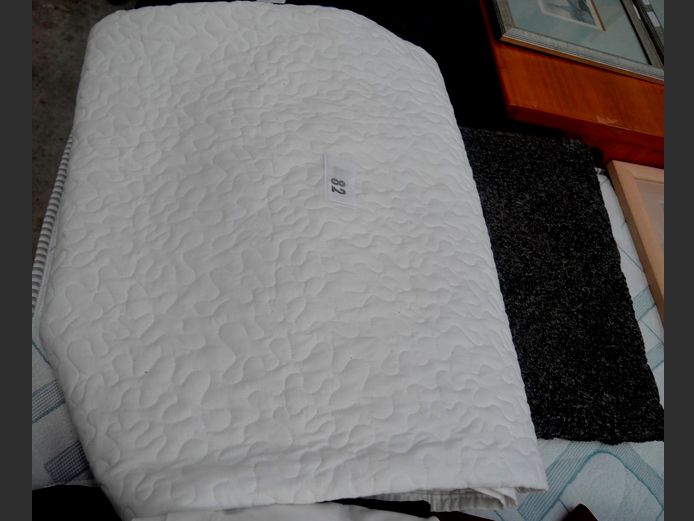 WHITE COMFORTER & A GREY BATH MAT